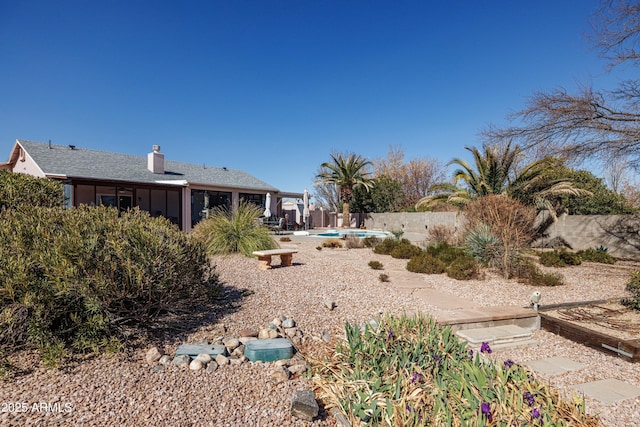 view of yard featuring a fenced in pool, a fenced backyard, and a patio