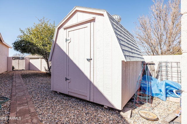 view of shed with a fenced backyard