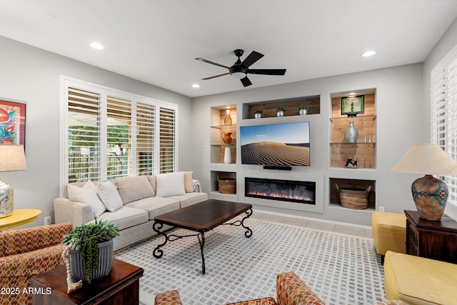 tiled living room featuring built in features, recessed lighting, and ceiling fan