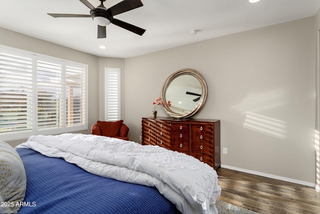 bedroom featuring a ceiling fan, recessed lighting, wood finished floors, and baseboards