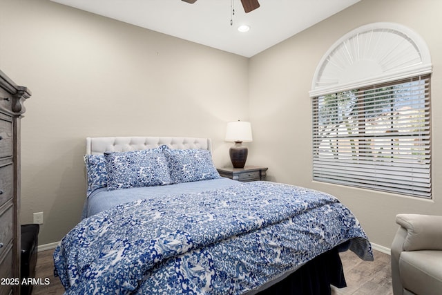 bedroom featuring recessed lighting, a ceiling fan, baseboards, and wood finished floors