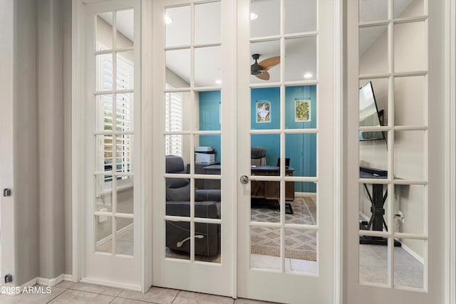 doorway featuring tile patterned flooring, french doors, and a ceiling fan