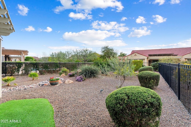 view of yard featuring a pergola and fence