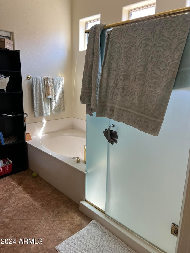 bathroom featuring shower with separate bathtub and tile patterned floors