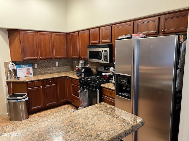 kitchen with decorative backsplash, light stone countertops, and stainless steel appliances