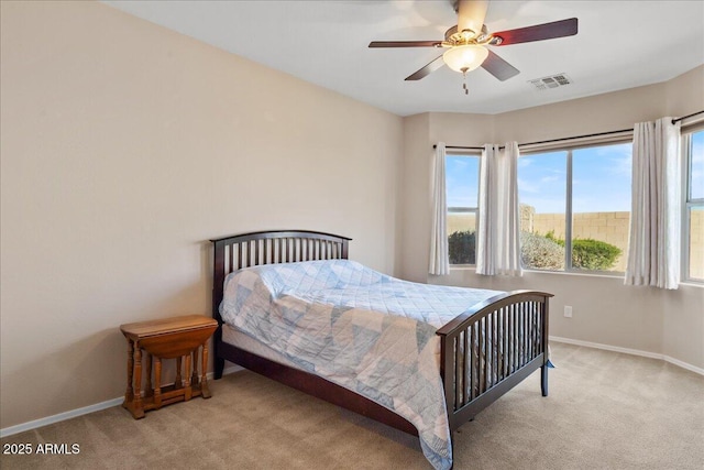 bedroom featuring light carpet and ceiling fan