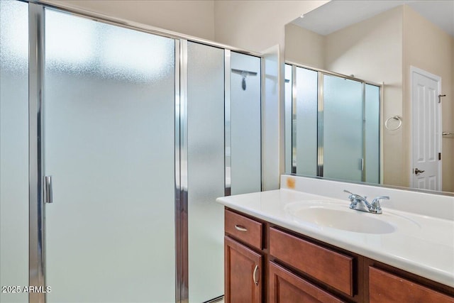 bathroom with vanity and walk in shower