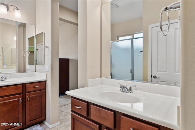 bathroom featuring vanity and an enclosed shower