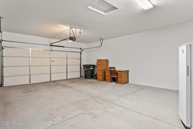 garage featuring a garage door opener and refrigerator