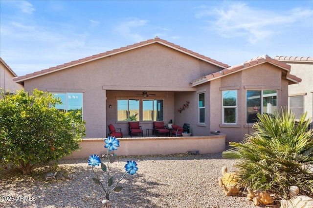 back of house with a patio and ceiling fan