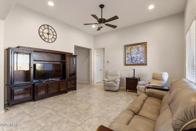 living room with ceiling fan and light tile patterned floors