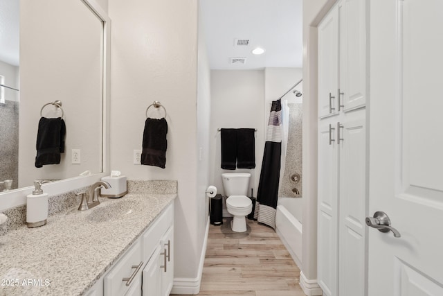4976 E Thunderbird Dr, Chandler, AZ 85249 - bathroom with wood finished floors, vanity, toilet, and baseboards