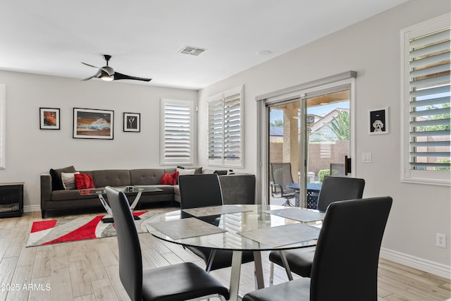 4976 E Thunderbird Dr, Chandler, AZ 85249 - dining area featuring light wood-type flooring, a ceiling fan, and baseboards