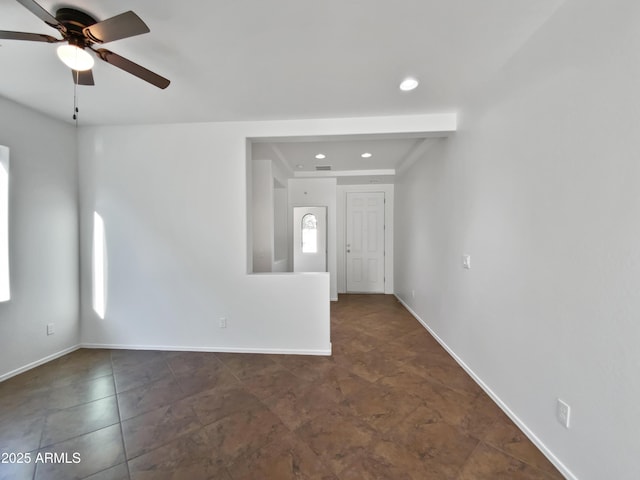 unfurnished room with a healthy amount of sunlight and ceiling fan