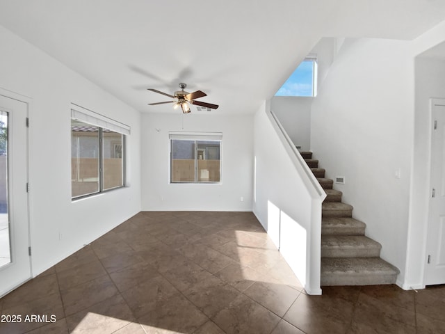 interior space featuring ceiling fan