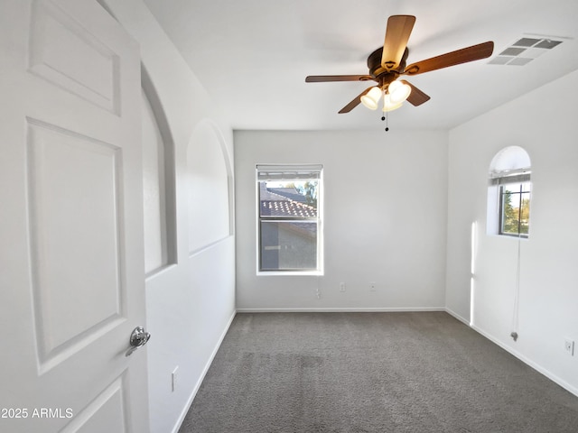 carpeted empty room with ceiling fan