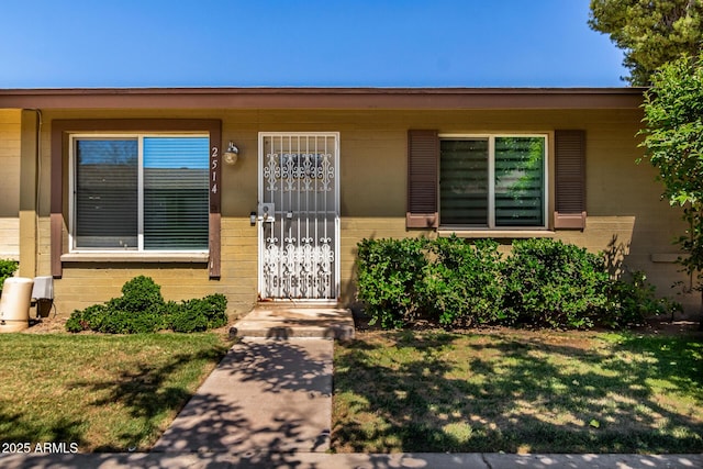 2514 N 22nd Ave, Phoenix, AZ 85009 - entrance to property featuring concrete block siding and a lawn