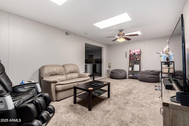 2514 N 22nd Ave, Phoenix, AZ 85009 - living room with a skylight, carpet floors, and ceiling fan