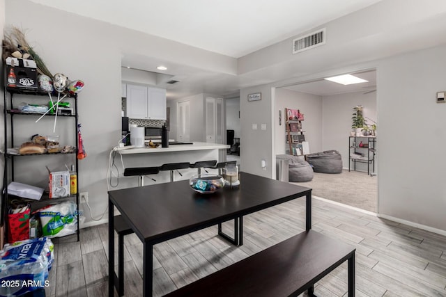2514 N 22nd Ave, Phoenix, AZ 85009 - dining area with light wood-style floors, baseboards, and recessed lighting