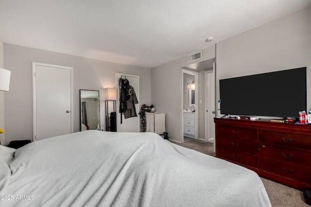 2514 N 22nd Ave, Phoenix, AZ 85009 - carpeted bedroom with baseboards and ensuite bath
