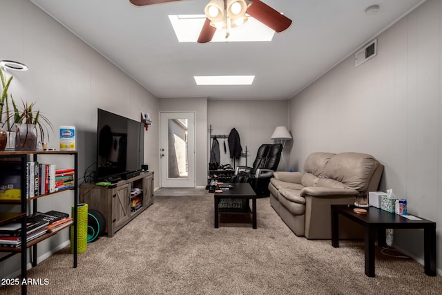 2514 N 22nd Ave, Phoenix, AZ 85009 - living room featuring a ceiling fan, carpet floors, and a skylight