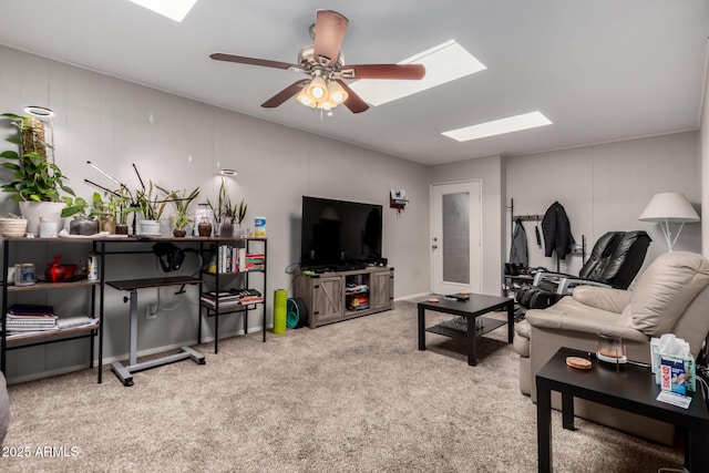 2514 N 22nd Ave, Phoenix, AZ 85009 - living room featuring a skylight, carpet floors, and a ceiling fan