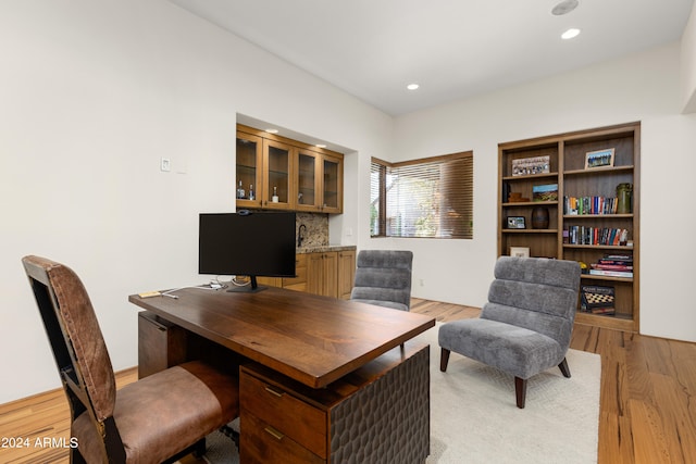 office with light wood-type flooring