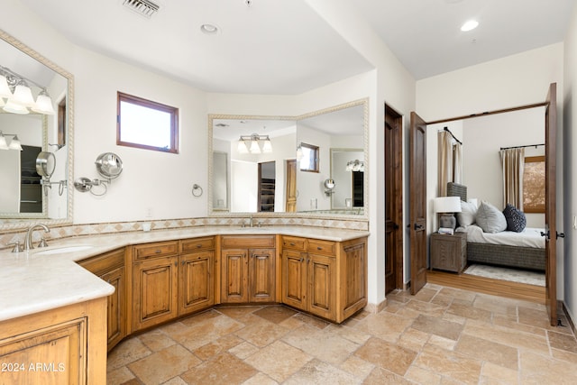 bathroom with tile floors and vanity