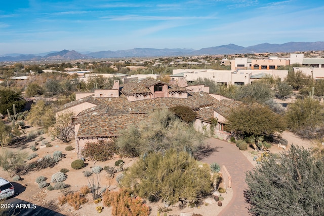 birds eye view of property featuring a mountain view