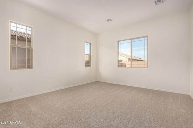 unfurnished room with carpet flooring