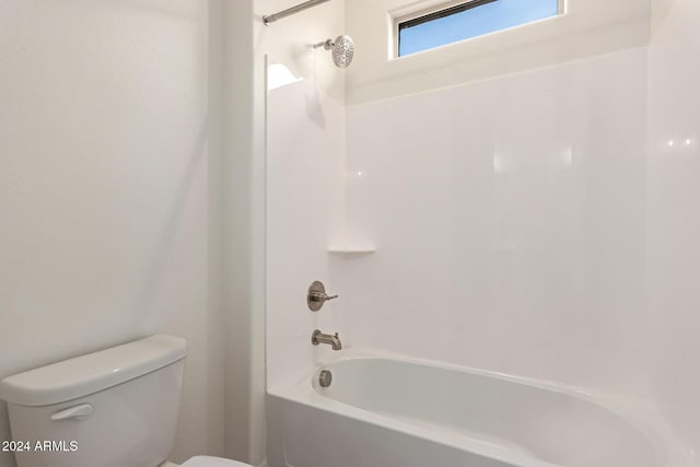 bathroom with shower / bath combination and toilet