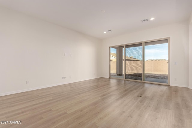 unfurnished room featuring light hardwood / wood-style flooring