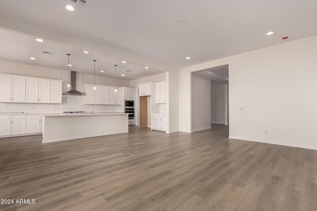 unfurnished living room featuring wood-type flooring