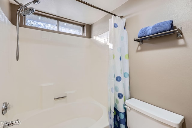 bathroom with toilet and shower / tub combo with curtain