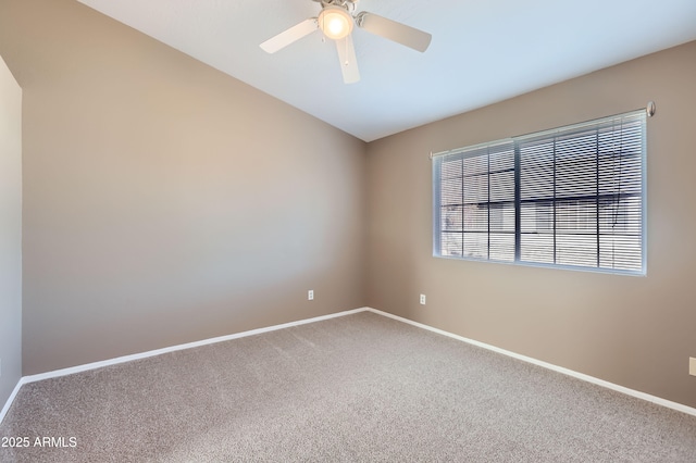 carpeted empty room featuring ceiling fan