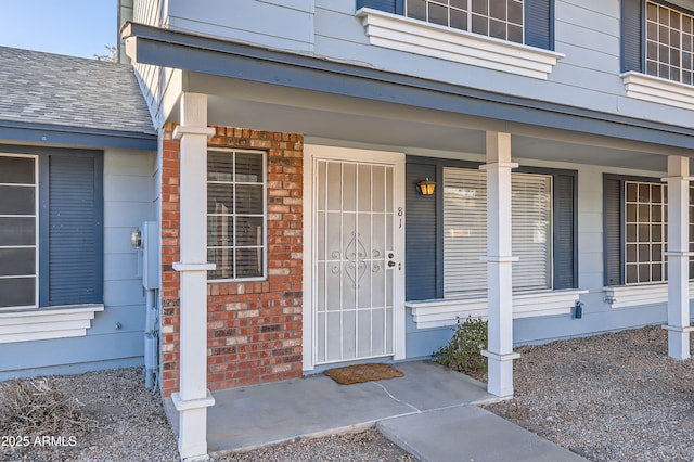 doorway to property with covered porch