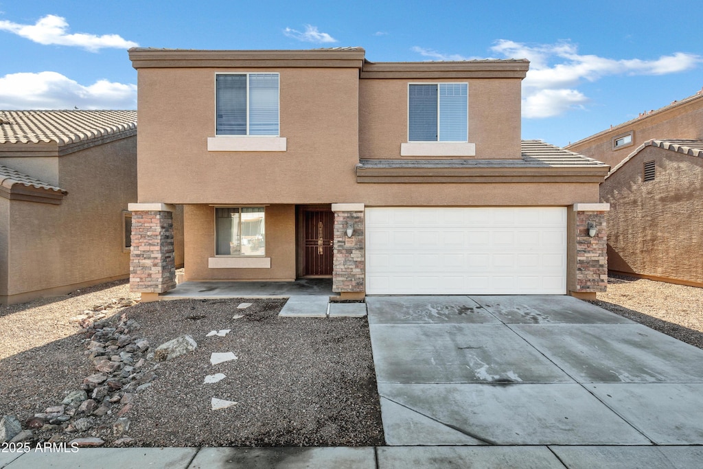 view of front of property with a garage