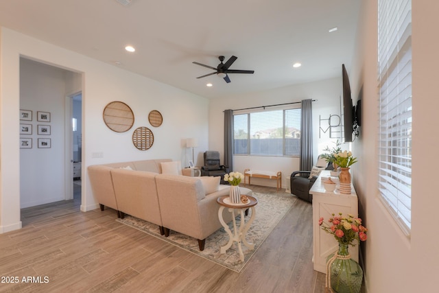 living room featuring ceiling fan