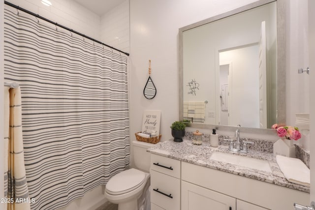 bathroom with a shower with curtain, vanity, and toilet