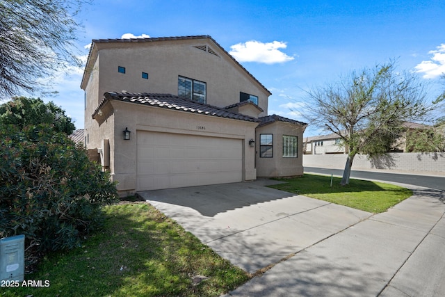 view of front facade featuring driveway, a garage, a tiled roof, fence, and stucco siding