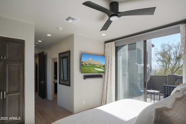 bedroom with hardwood / wood-style floors and ceiling fan