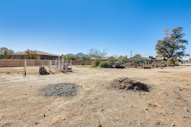 view of yard featuring a mountain view and a rural view