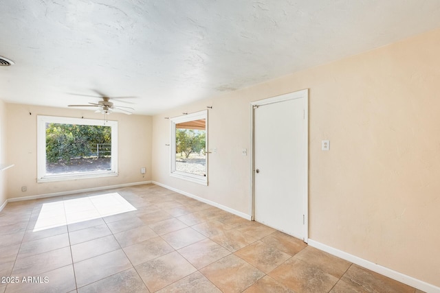 spare room featuring ceiling fan