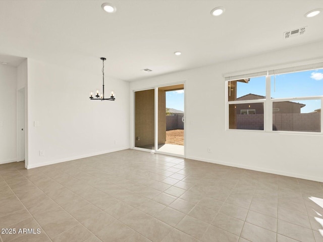 unfurnished room featuring baseboards, plenty of natural light, visible vents, and recessed lighting