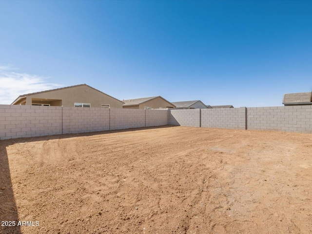 view of yard with a fenced backyard