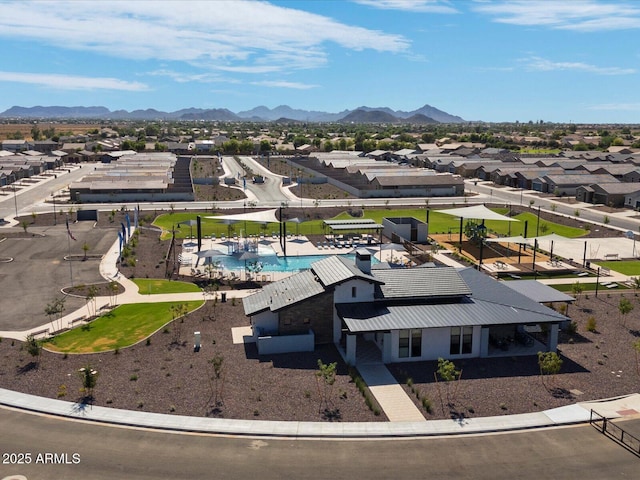 drone / aerial view featuring a residential view and a mountain view