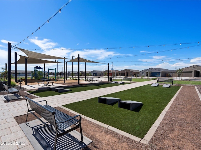 view of community with a lawn and a residential view