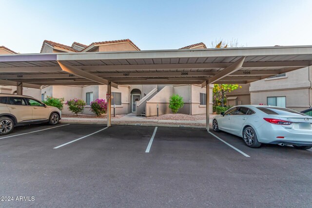 view of vehicle parking featuring a carport