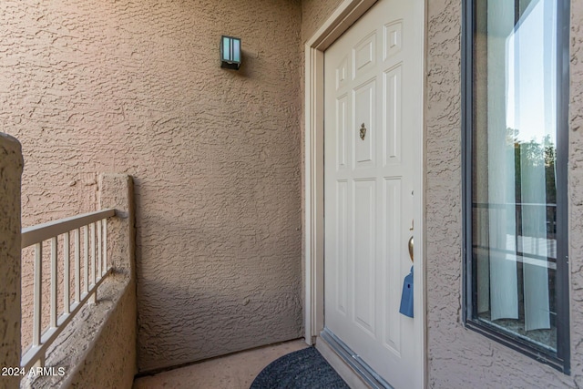 property entrance with a balcony