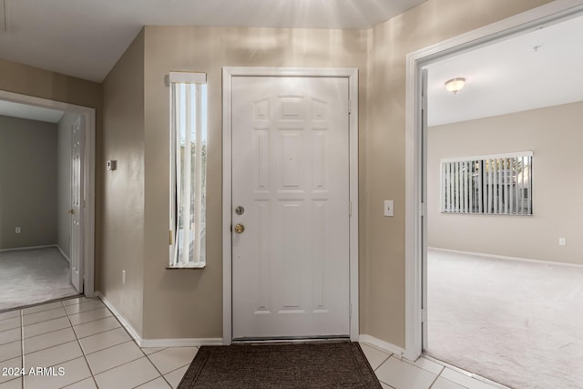 view of carpeted entrance foyer